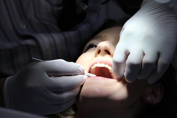Woman getting her teeth checked