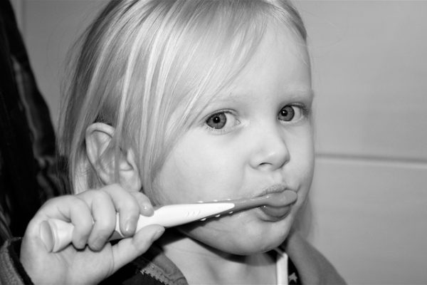 kid brushing teeth