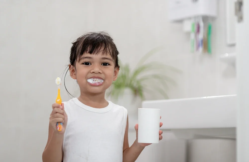 kid brushing teeth mouthwash